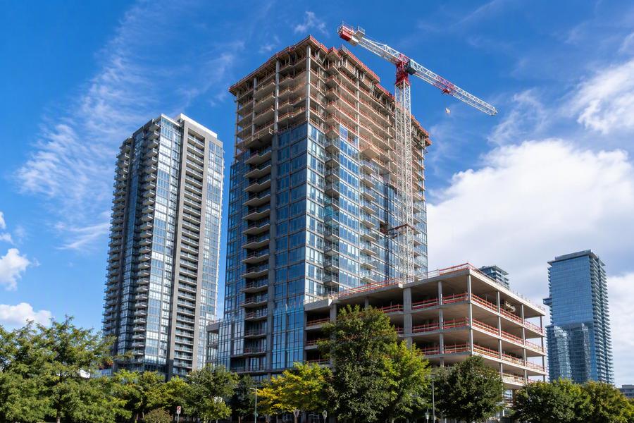 High-rise construction site with tower crane